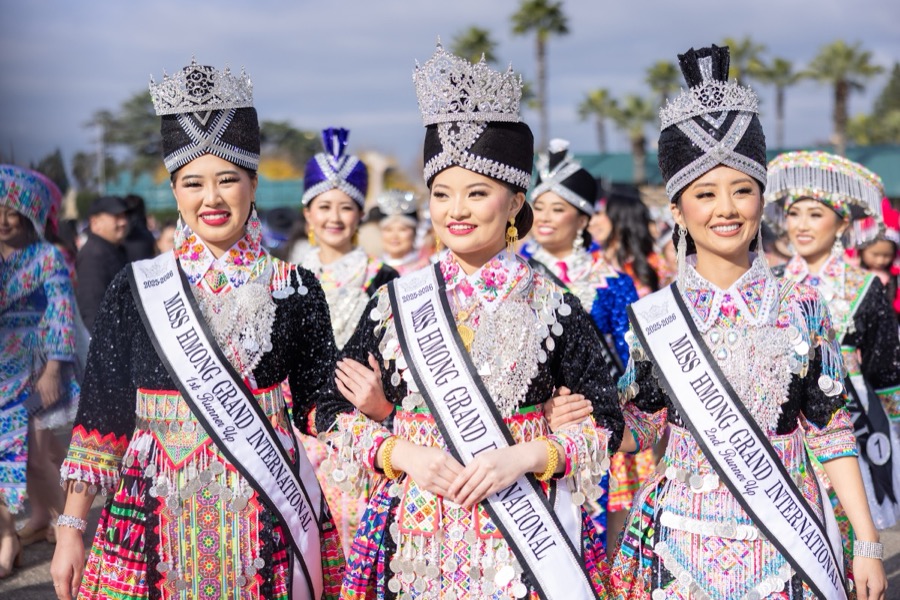 Miss Hmong Grand International titleholders in full ceremonial dress and silver crowns.