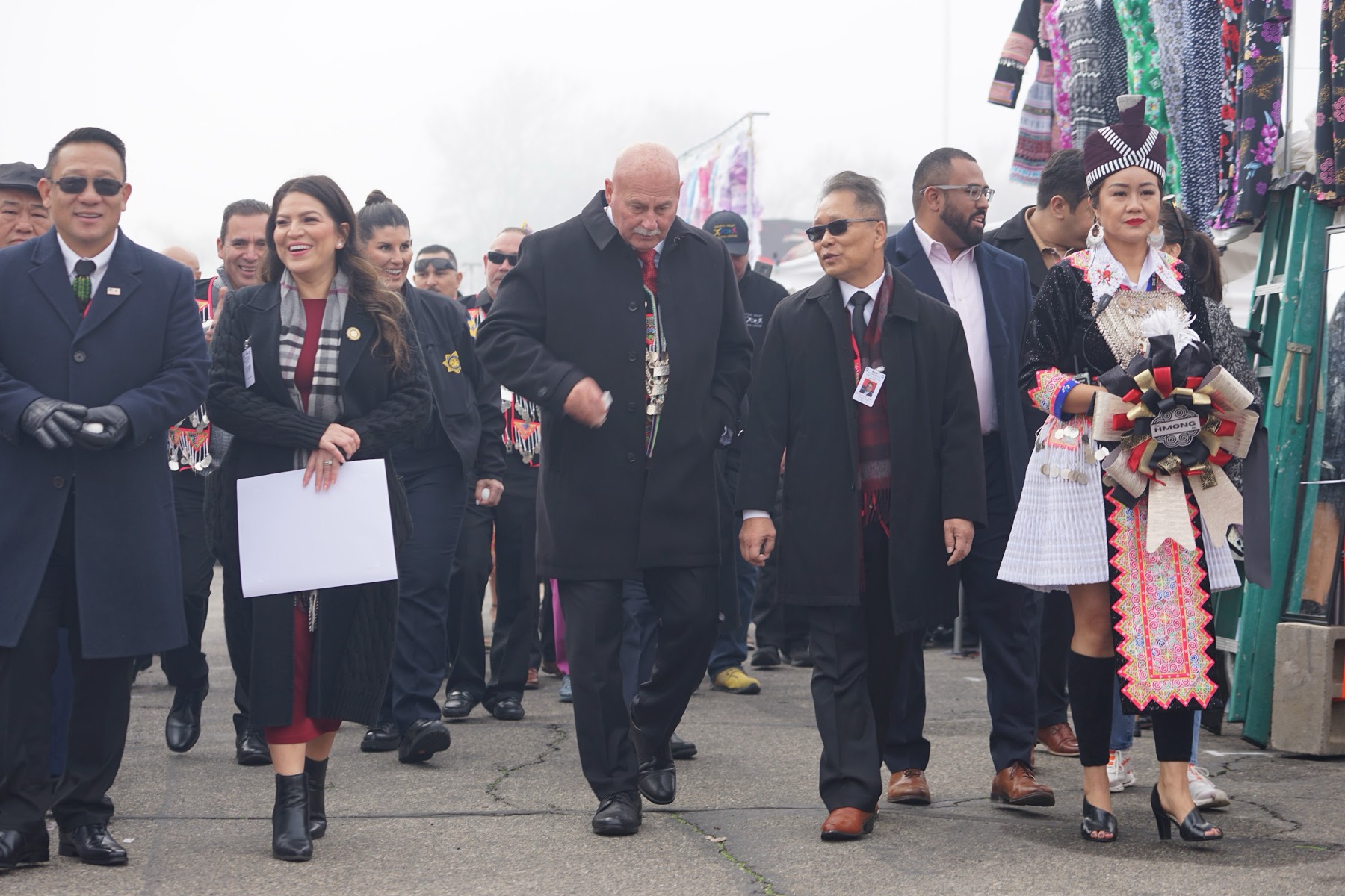 Civic leaders and community members walking the fairgrounds together on opening morning.